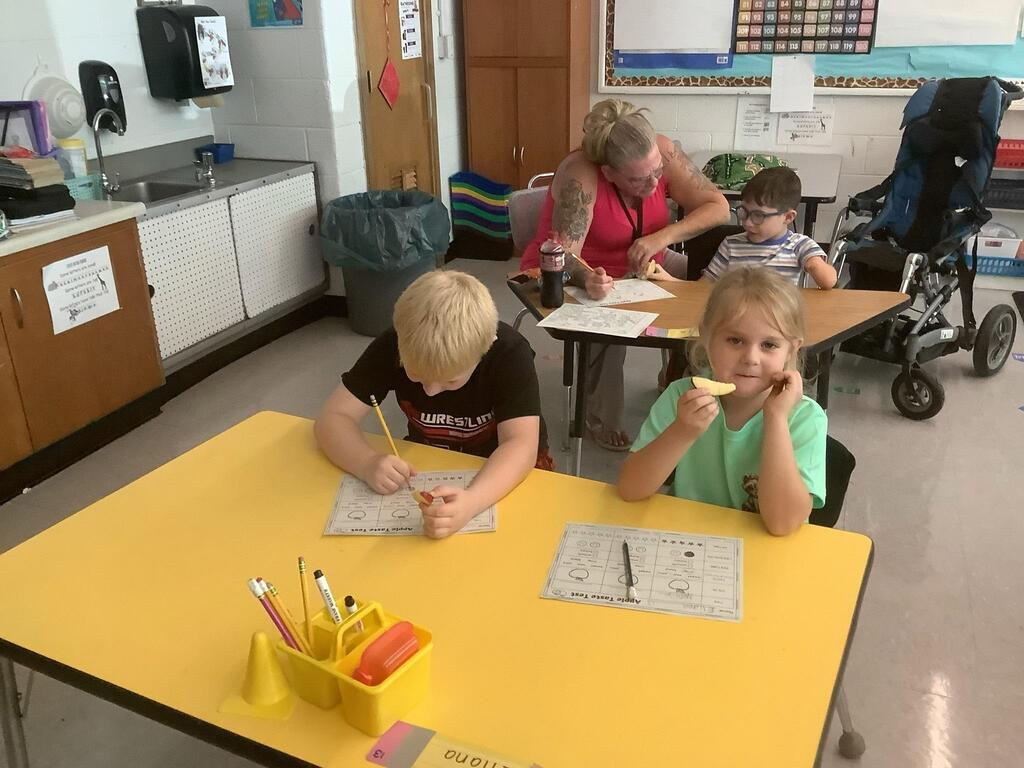 students eating apples