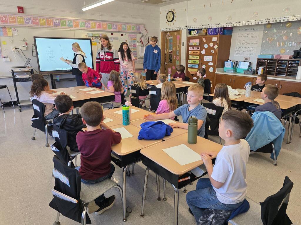 students engaging in french lesson.