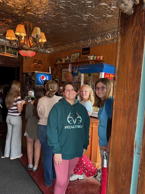 students in line for popcorn