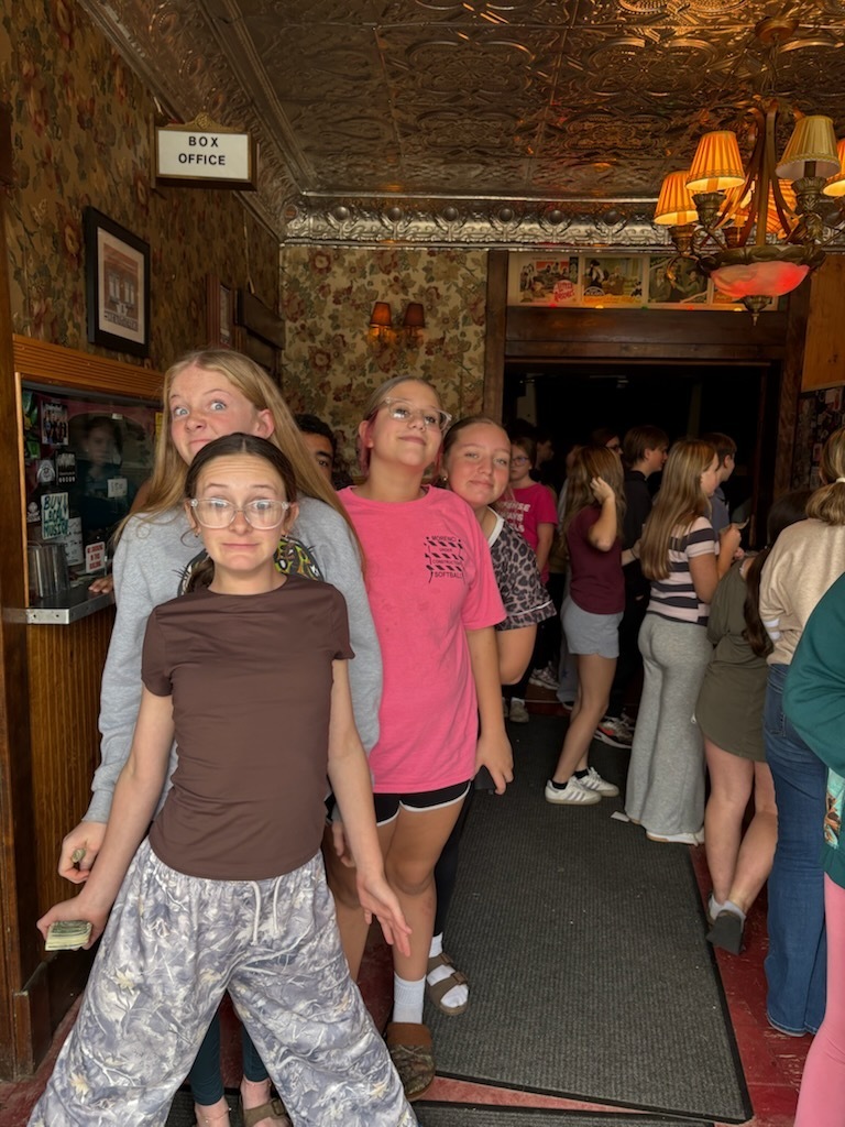 students in line for popcorn
