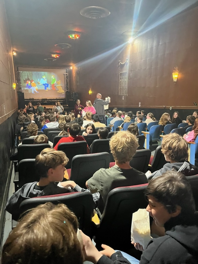 students watching a movie at the local theatre