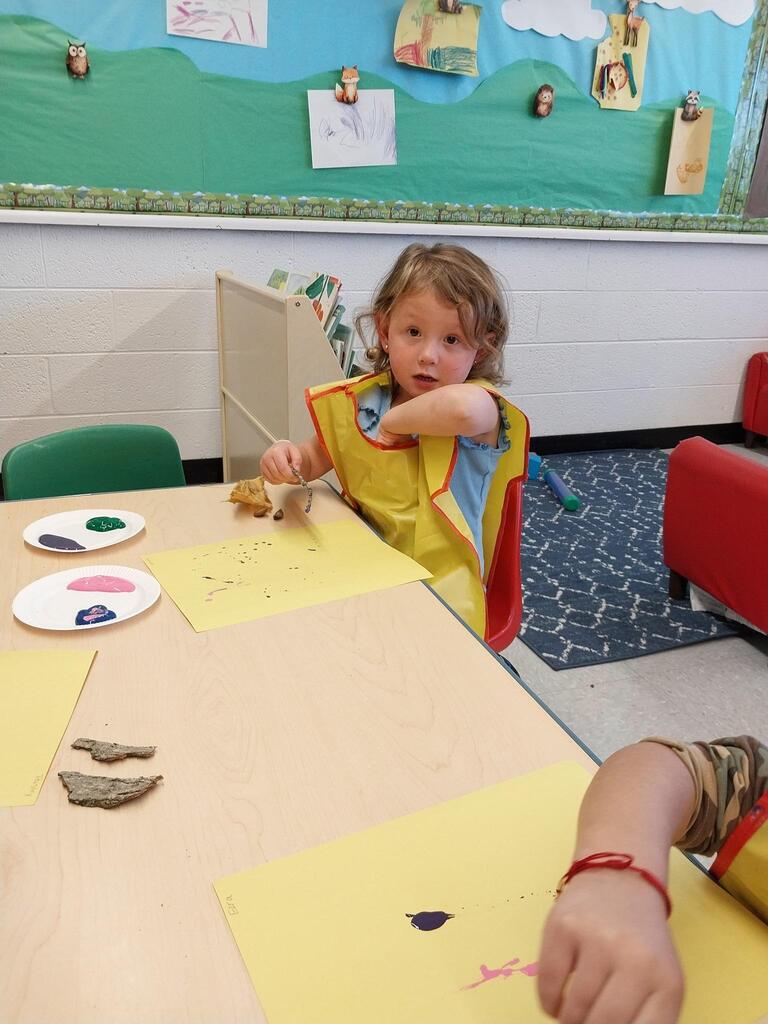 student painting art project