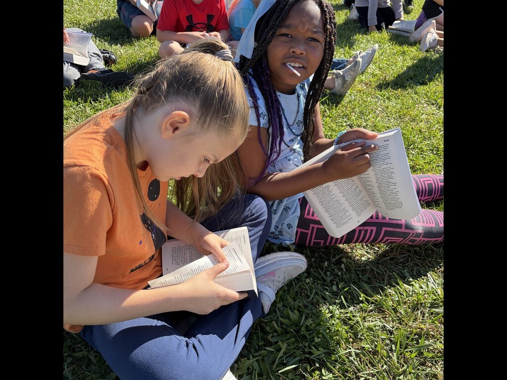 two students reading a dictionary