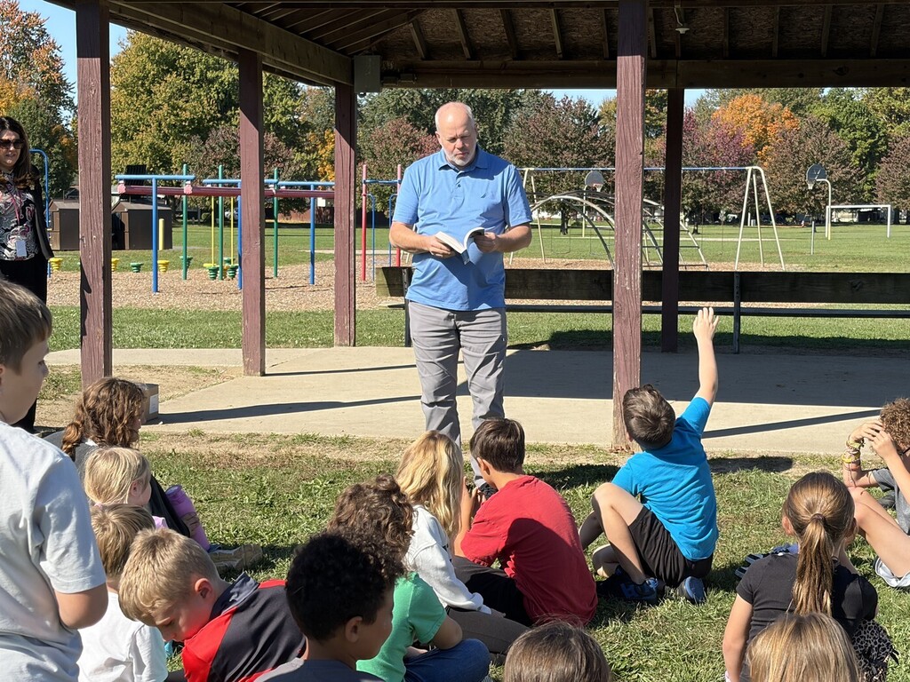 man talking to students