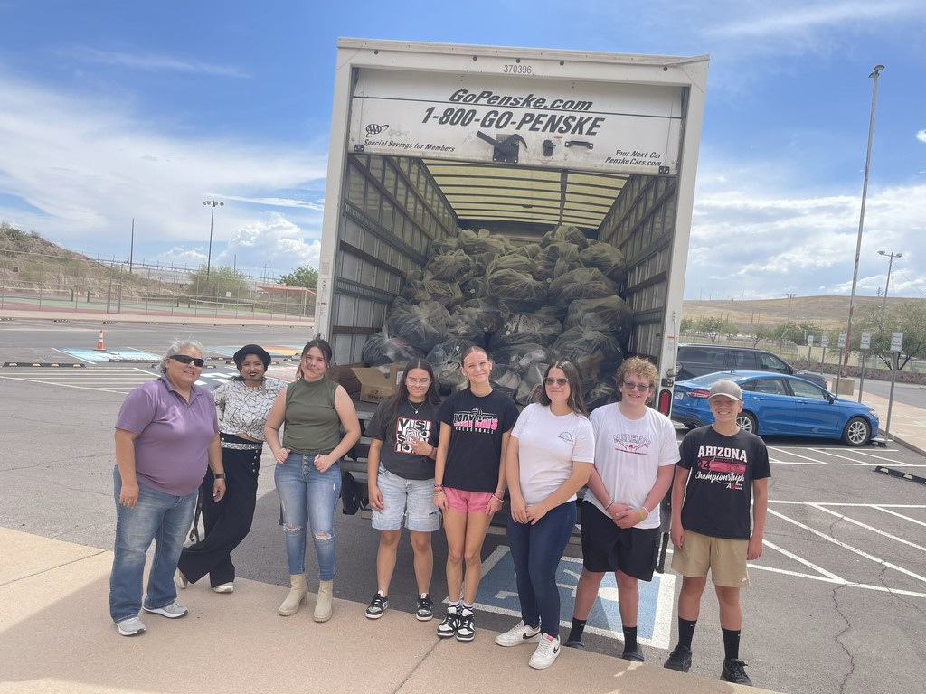 The MHS Pride Band showing off the 2675 pairs of shoes collected for their recent fundraiser.