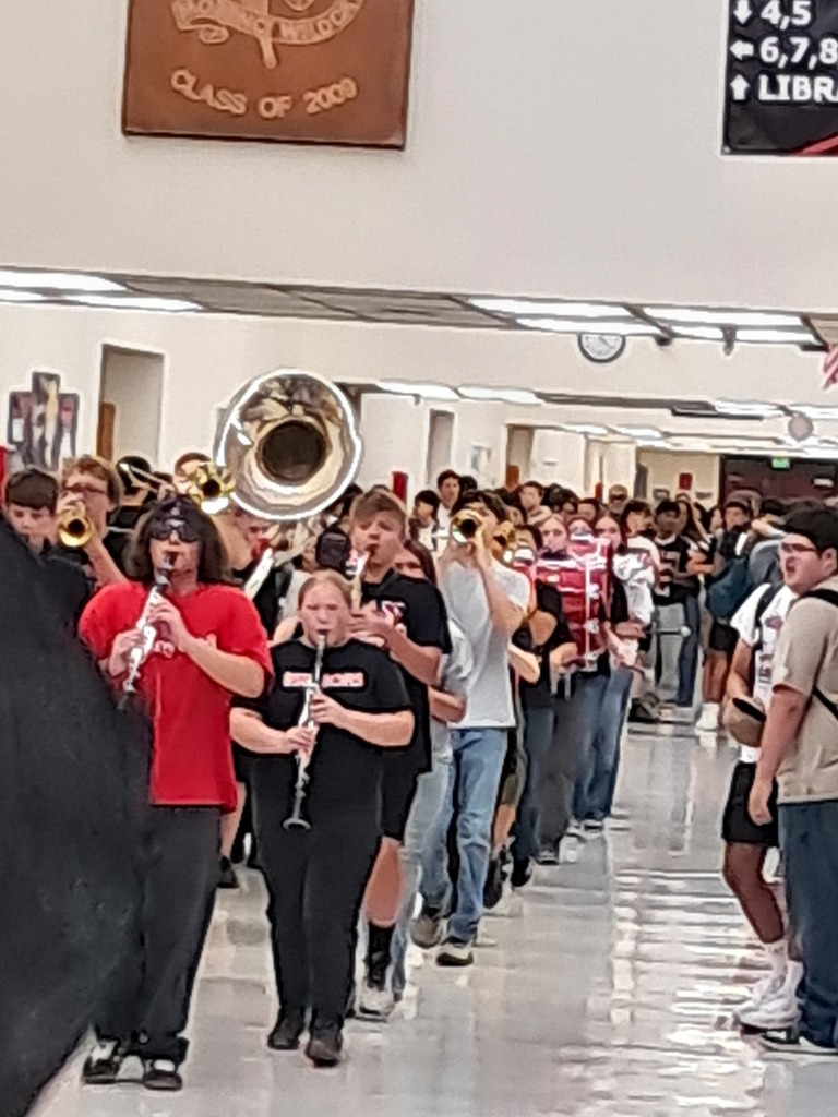 The Morenci Pride Band marching in the MHS hallway.