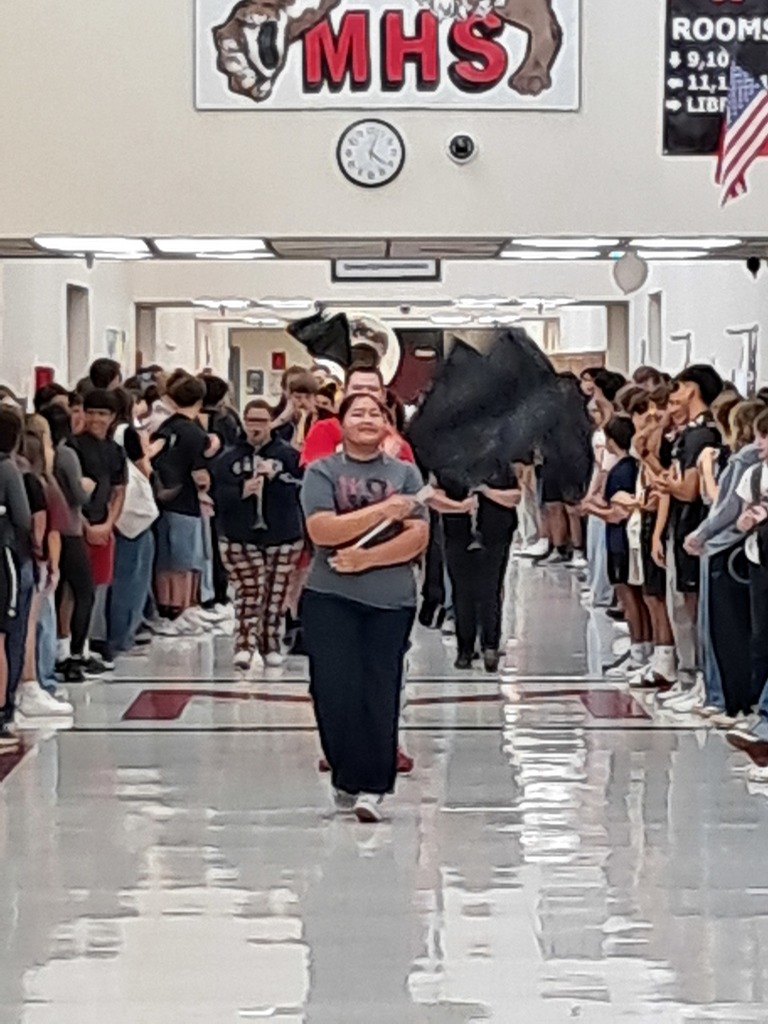 The MHS flagline leads the Pride Band as they march in the hallway.