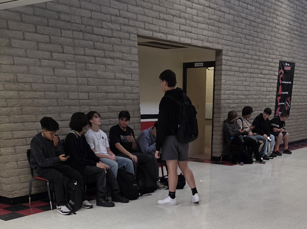 MHS students enjoying a lace to sit and wait for the bell on new benches created by our Wildcat Welders out of old desks that were headed for disposal.