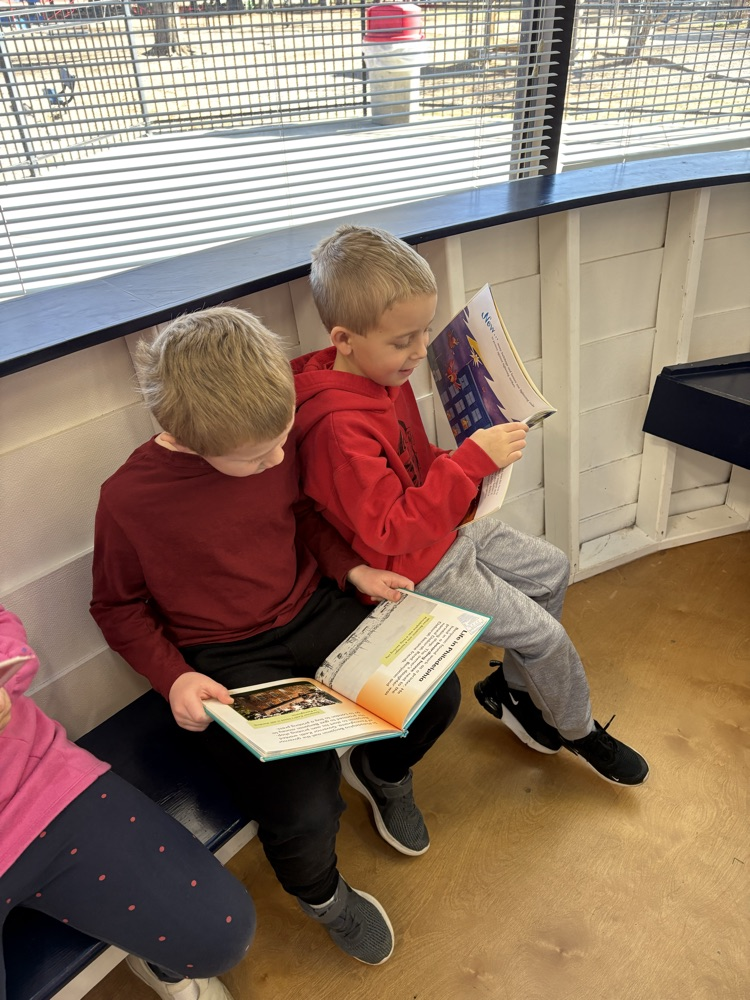 reading biographies in the boat
