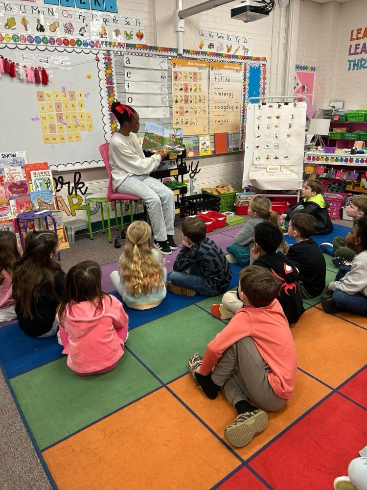 high school students read to students at mcps