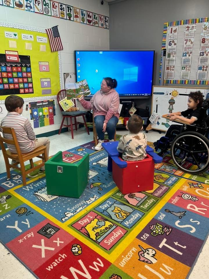 high school students read to students at mcps