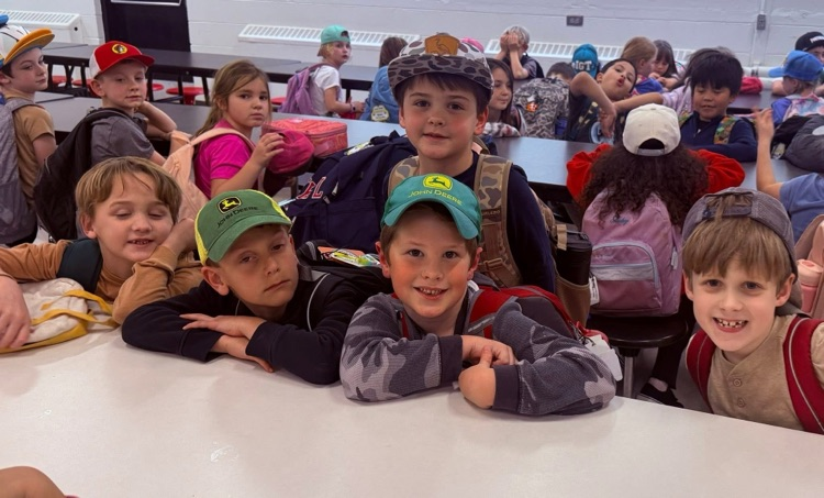 students wearing hats to celebrate reading nonfiction books