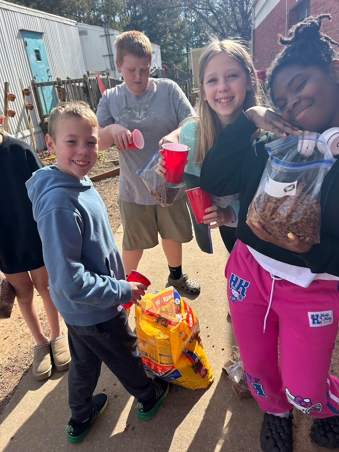 students diving the dog food into packets