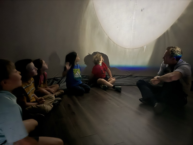 students in the Star Lab viewing the sky with Mr. Dodd.