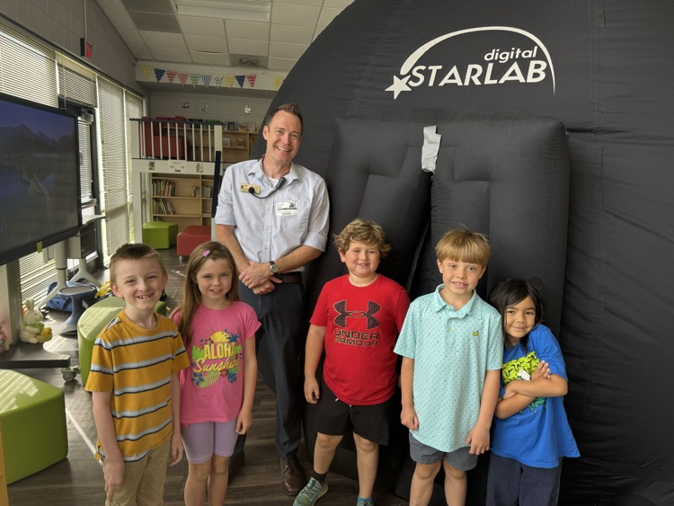 students in the Star Lab viewing the sky with Mr. Dodd.
