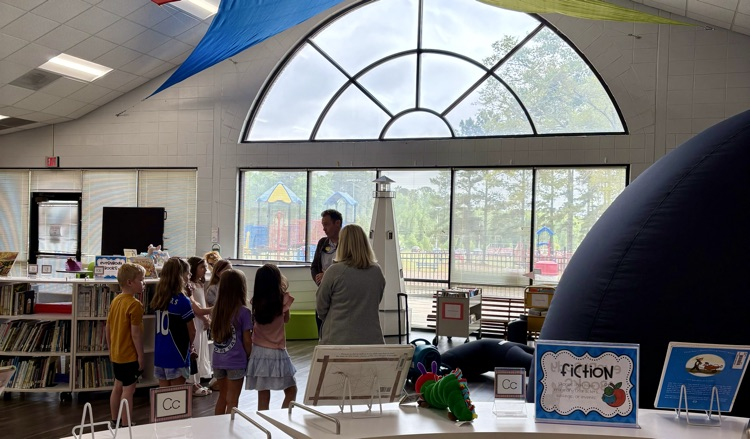 students in the Star Lab viewing the sky with Mr. Dodd.
