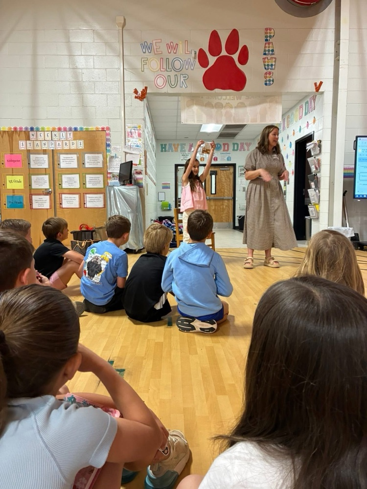 Students listen to a volunteer speak during the optional FCA Huddle.
