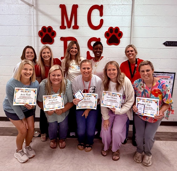 top five teacher of the year nominees with administrative team 