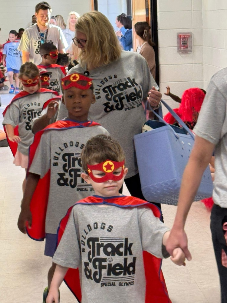 Students and staff cheered for our awesome students on their way to Special Olympics.