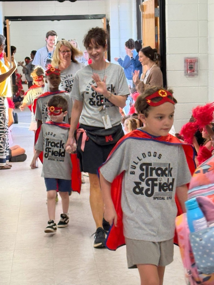 Students and staff cheered for our awesome students on their way to Special Olympics.