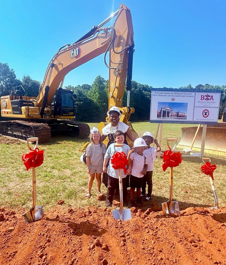 Mrs. Chapman and MCPS students pose with the shovels at the groundbreaking ceremony  