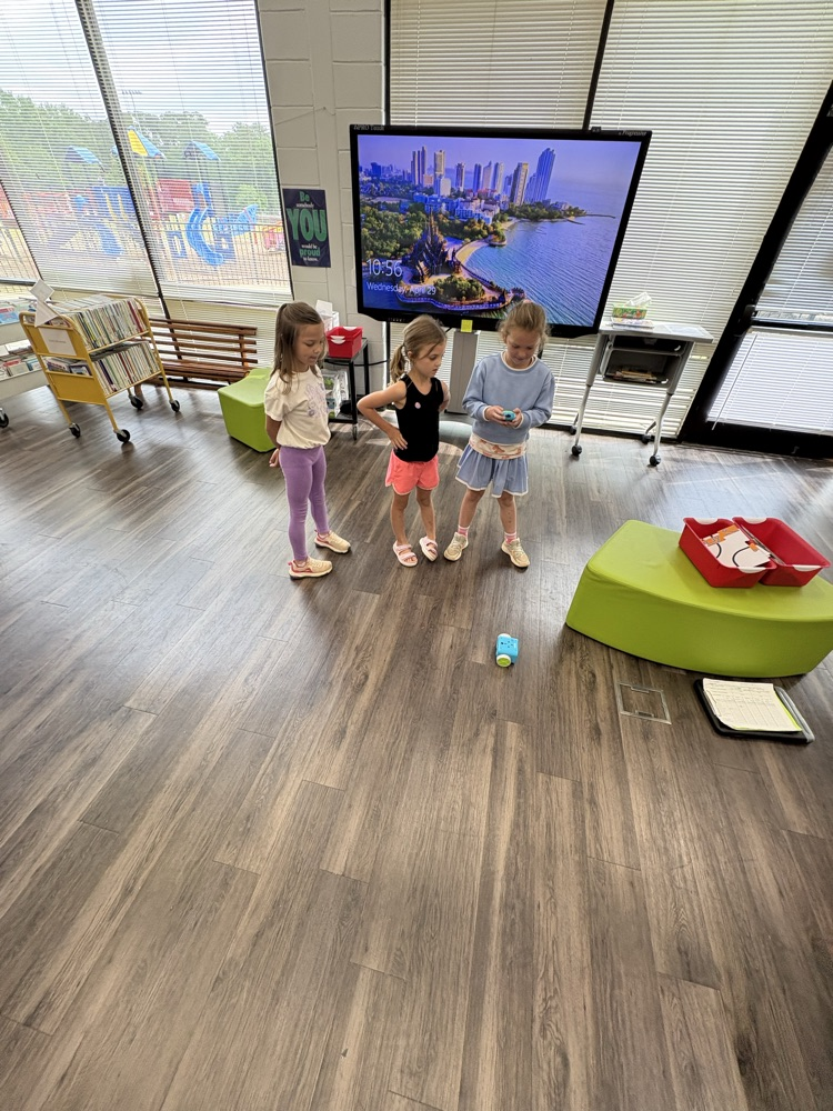 Students used a remote to code a new robot in the library  