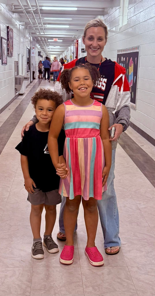  student with their teacher who received a bike for the most growth in reading test scores. 