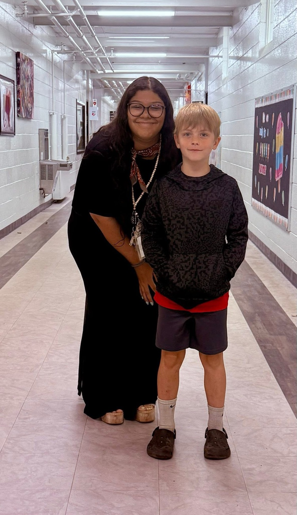  student with teacher who received a bike for the most growth in reading test scores. 