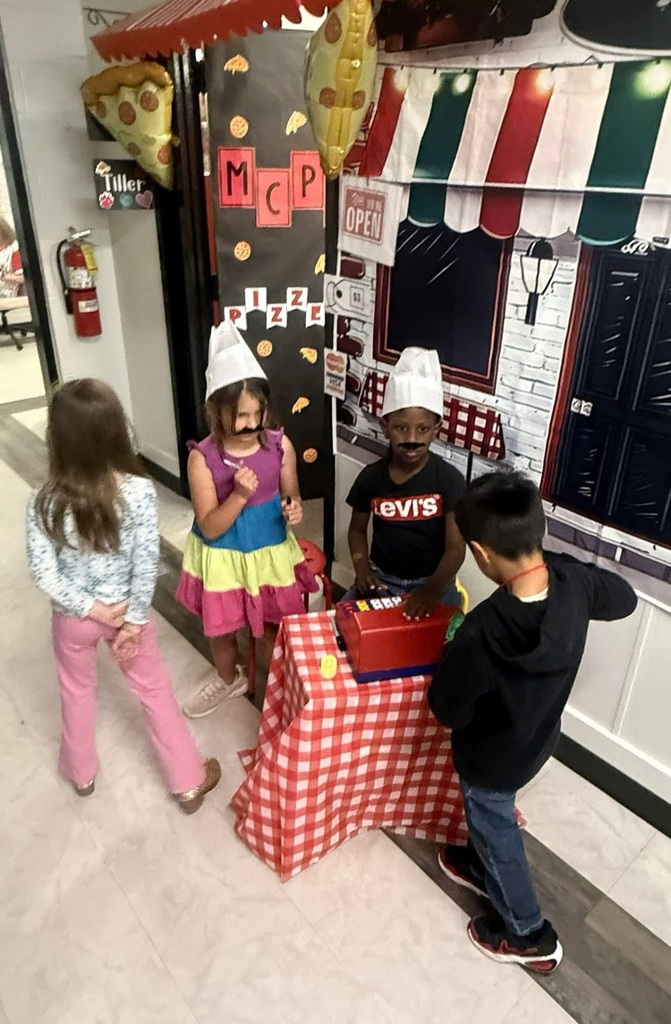 Kindergarten students practiced counting money during Tiny Town.