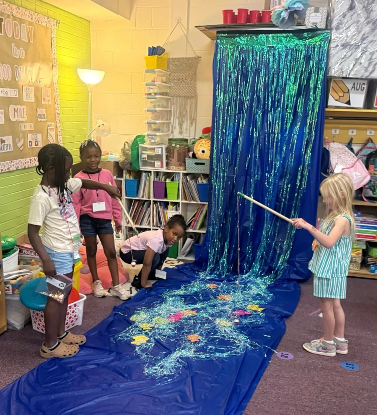 Kindergarten students practiced counting money during Tiny Town.