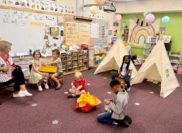 Kindergarten students practiced counting money during Tiny Town.