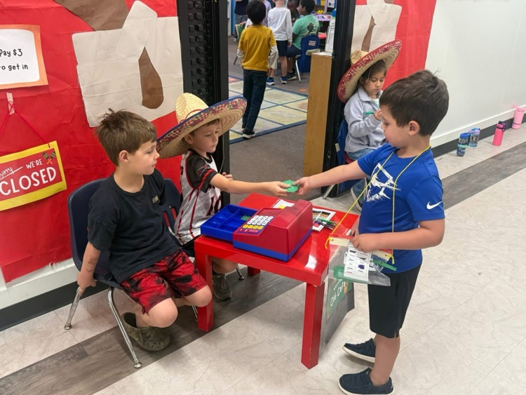 Kindergarten students practiced counting money during Tiny Town.