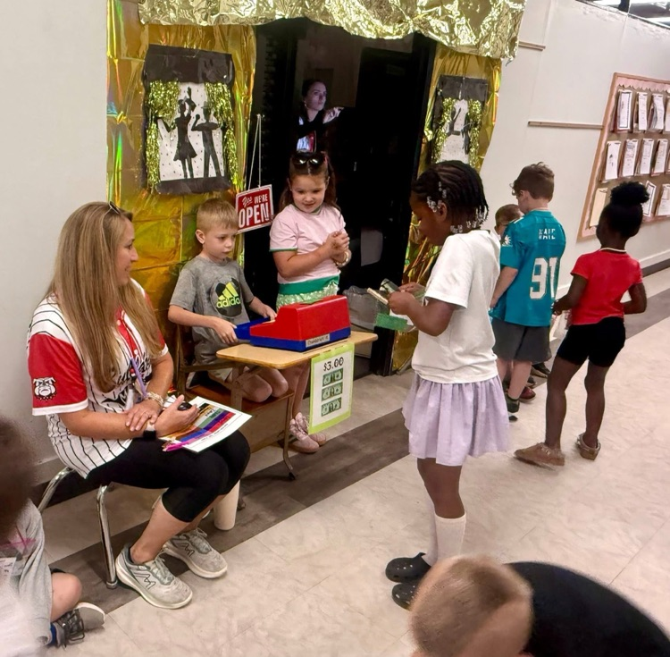 Kindergarten students practiced counting money during Tiny Town.