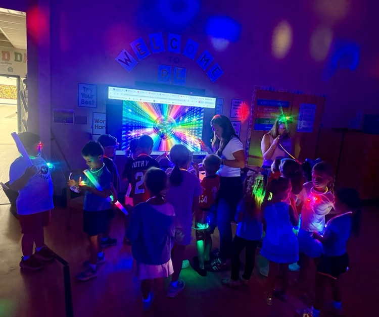 Glow party for students who raised $500 for fun run.
