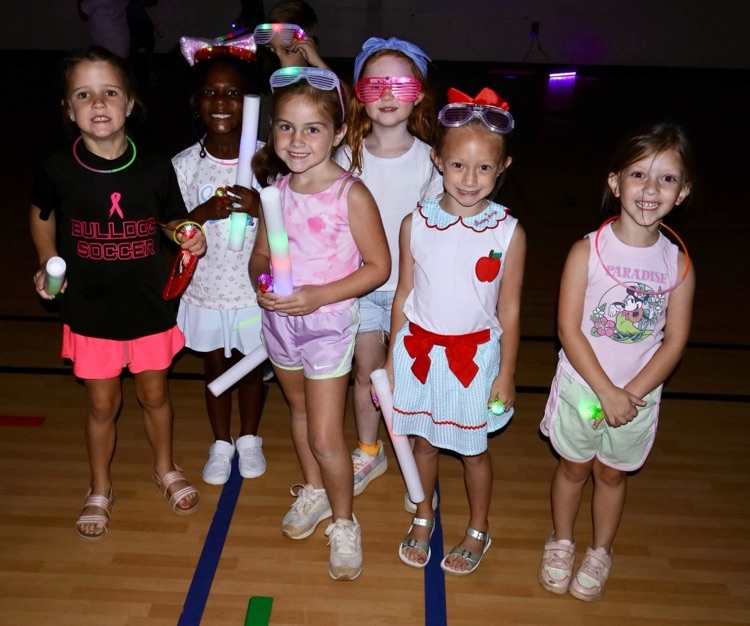 Glow party for students who raised $500 for fun run.