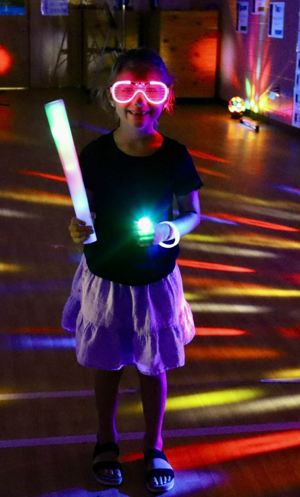 Glow party for students who raised $500 for fun run.