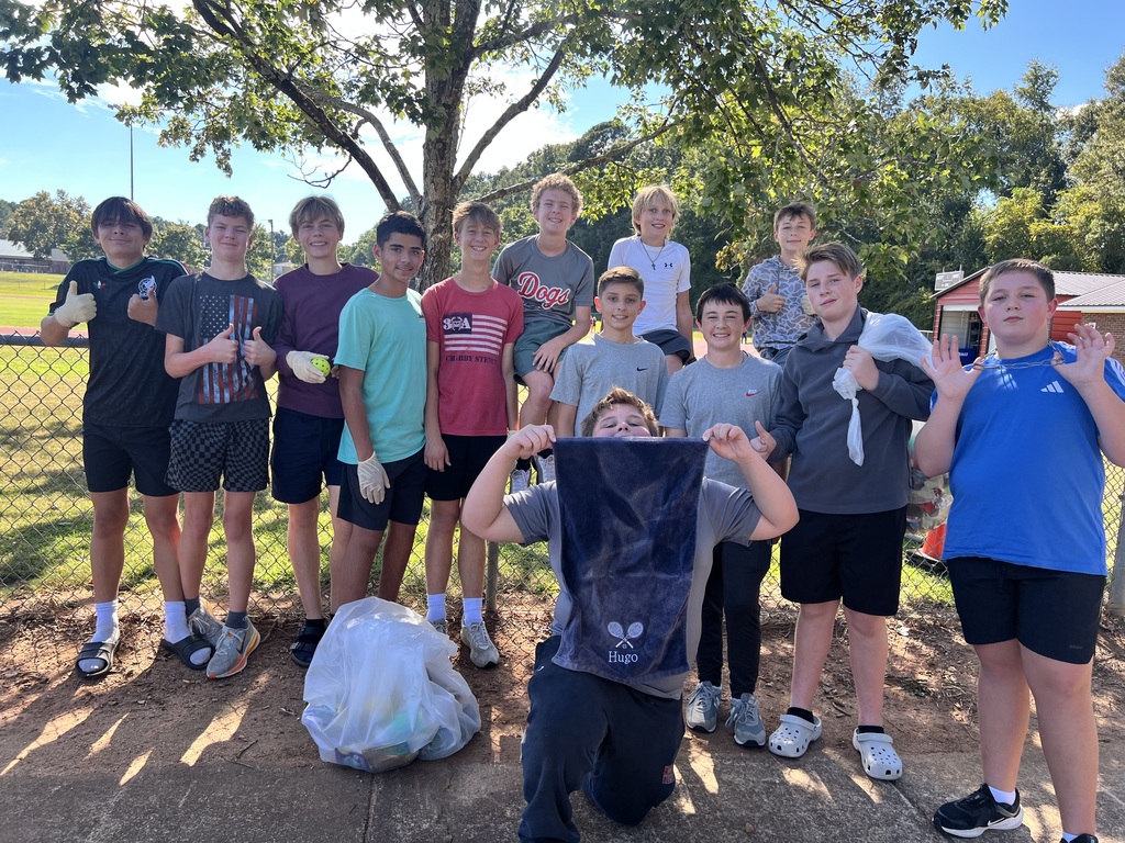 Photos show National Junior Honor Society students working together to clean up the school campus.
