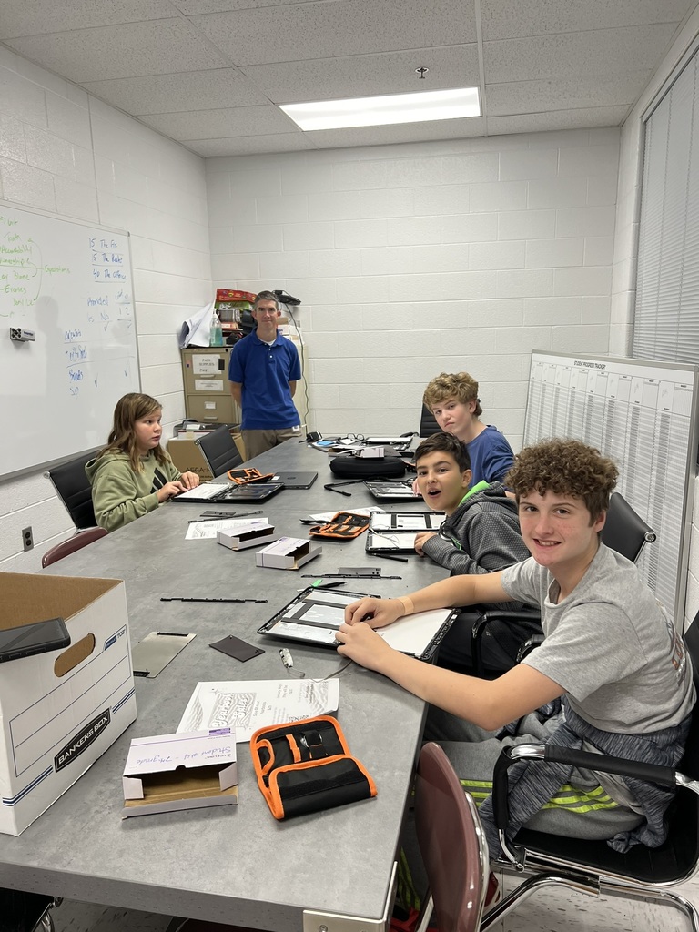Tech Club - Students taking apart Chromebooks.