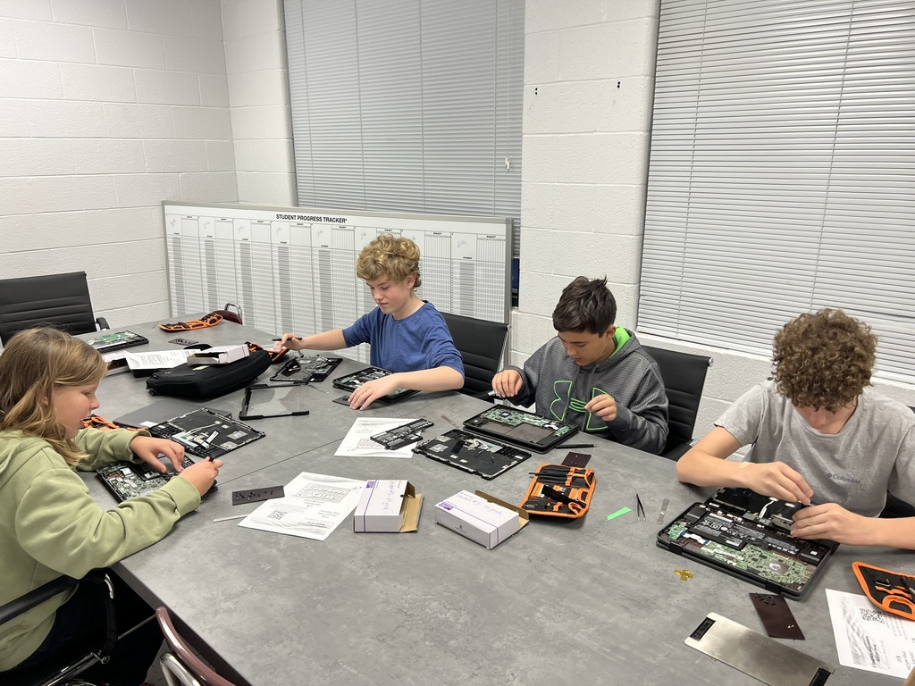 Tech Club - Students taking apart Chromebooks.