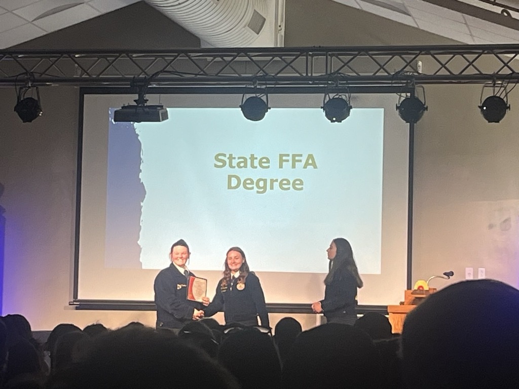 Zoey Thompson  receiving her State FFA Degree 