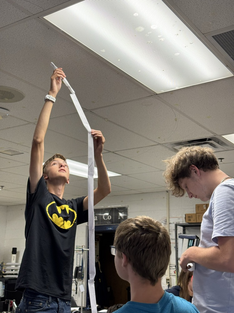 Liam attempts to get the tower to stand  