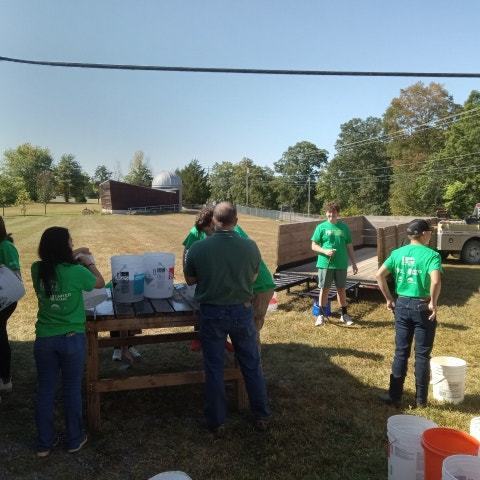 Students washing buckets for apple butter
