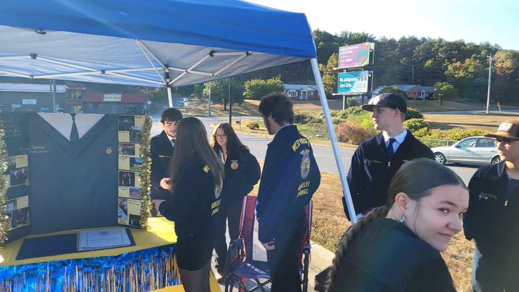 Members doing community outreach at Tractor Supply.