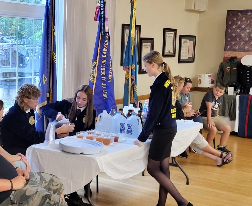 FFA members Camden Barney and Janine Hartman serving drinks to Empty Bowls 