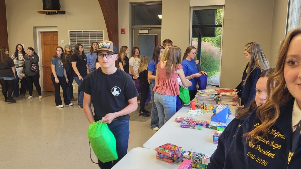 Students making goodie bags for children in need.