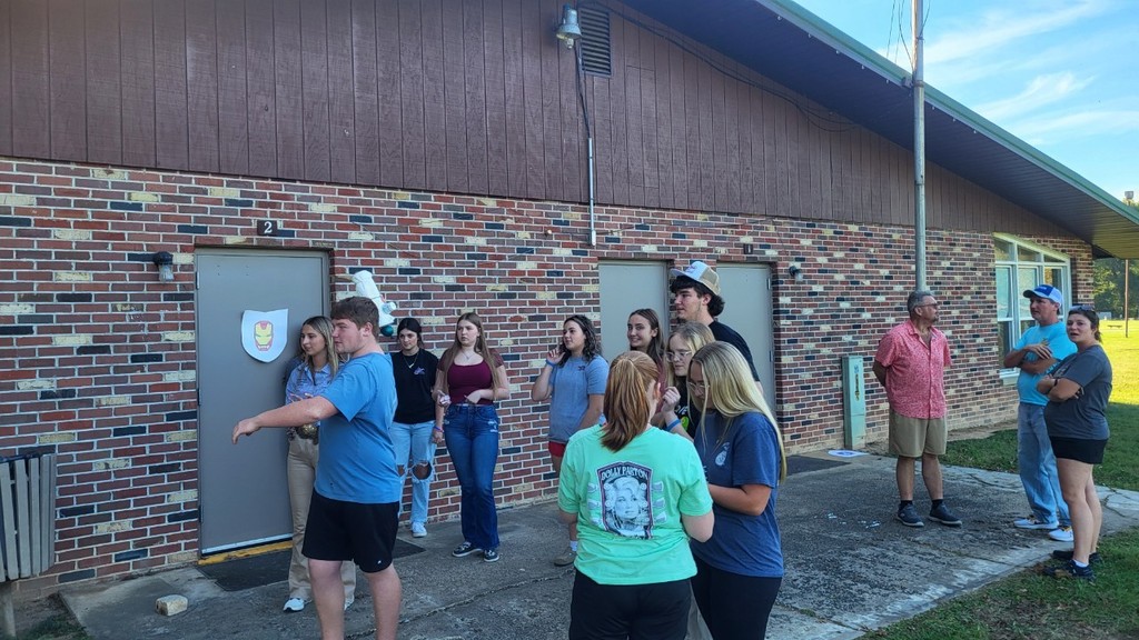 Students testing team building project to protect eggs from breaking when thrown.