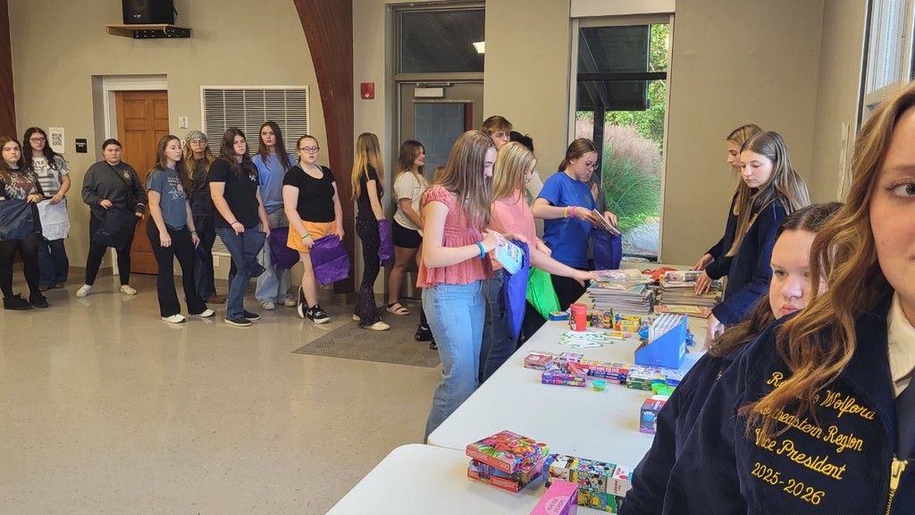 Students making goodie bags for children in need.