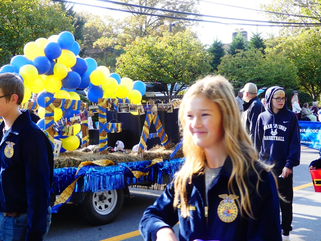 FFA member Ava Michael handing out candy. 