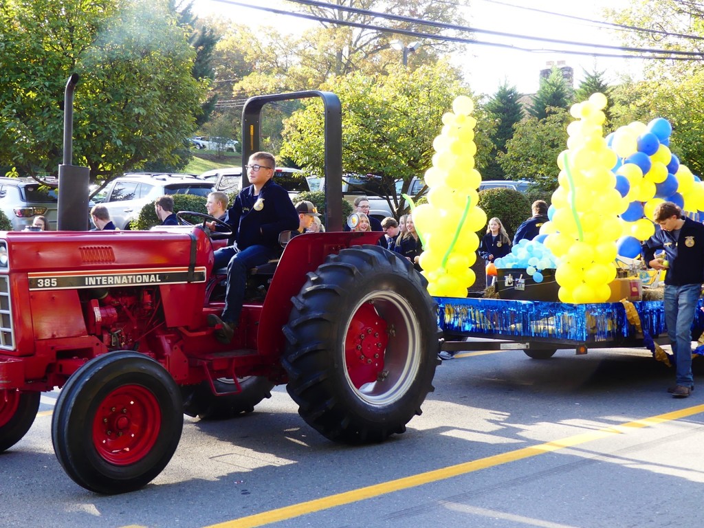 FFA member Wyatt Bartley driving tractor in Apple Butter Parade. 