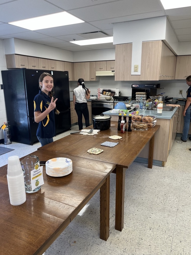 FFA member Charity Brown setting up serving table. 